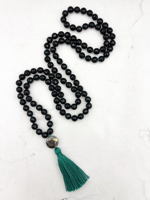 onyx gemstone mala with pyrite guru bead and green tassel | radiant malas | handmade in boulder, colorado
