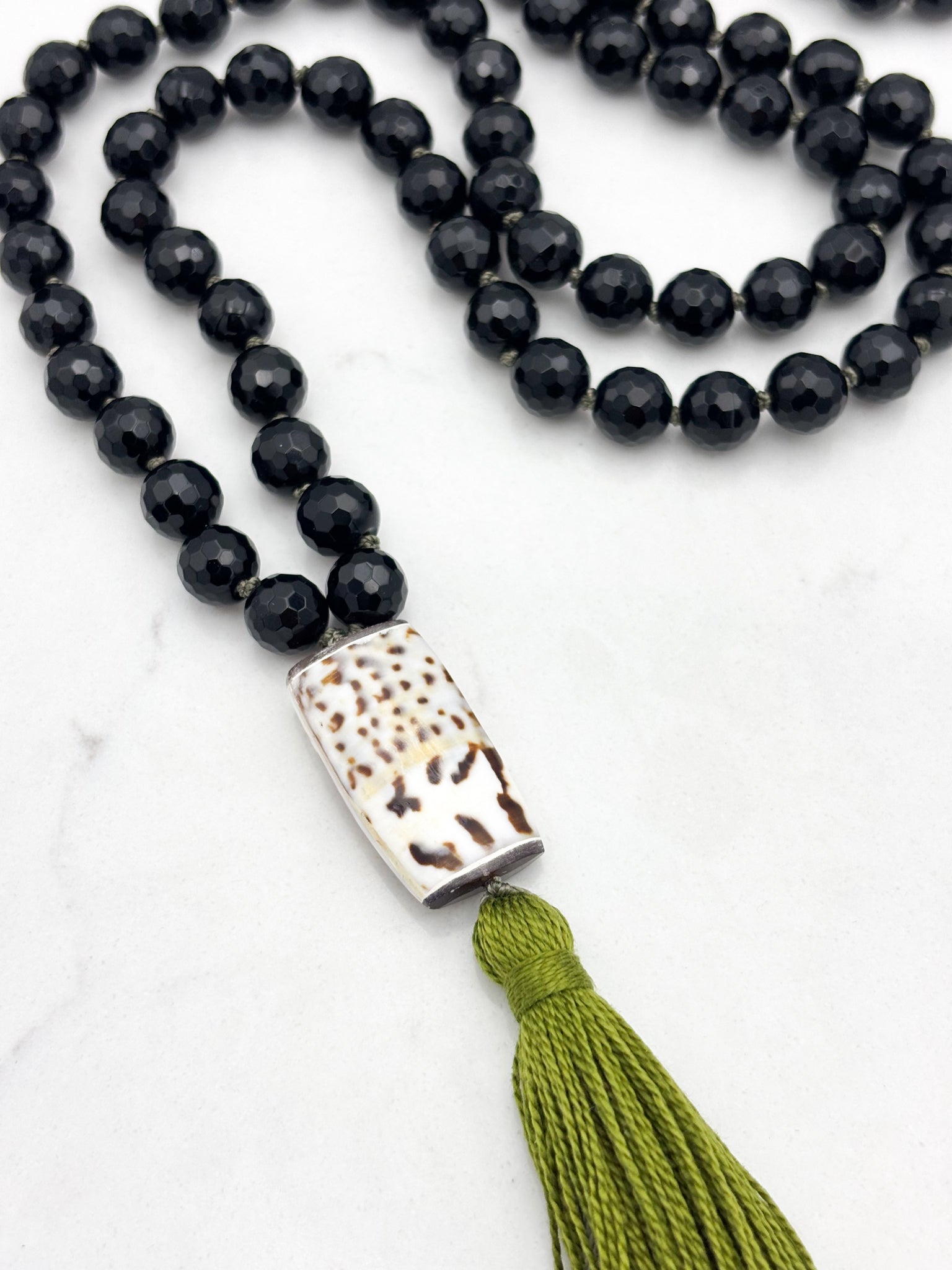 onyx gemstone mala with shell guru bead and green tassel | radiant malas | handmade in boulder, colorado