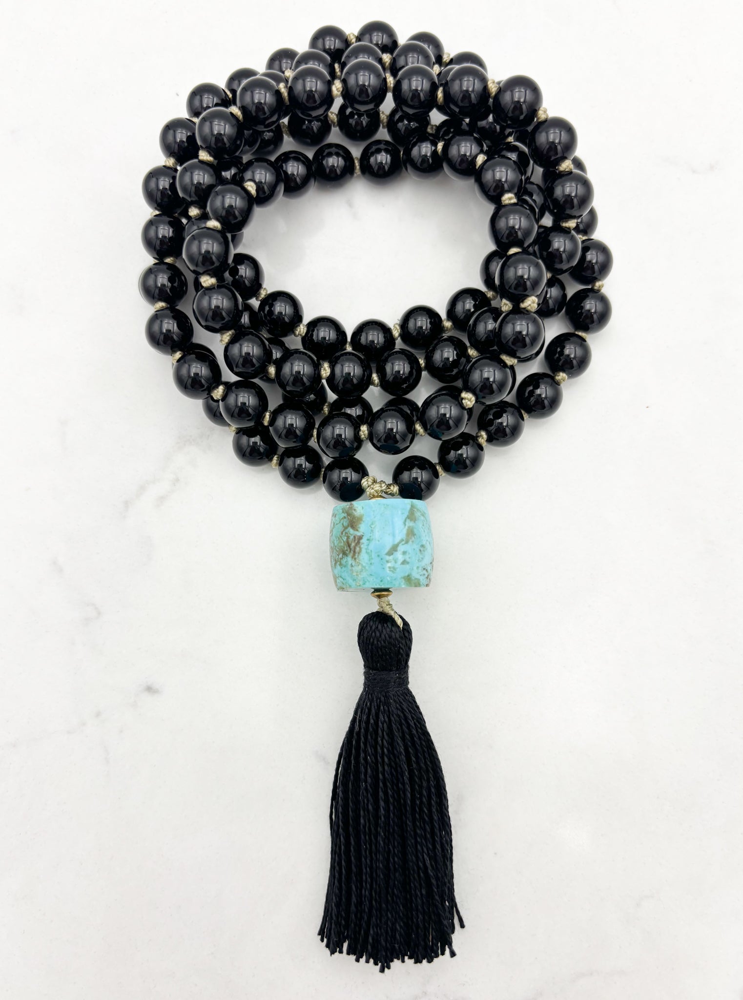 onyx gemstone mala with turquoise barrel guru bead and black tassel | radiant malas | handmade in boulder, colorado