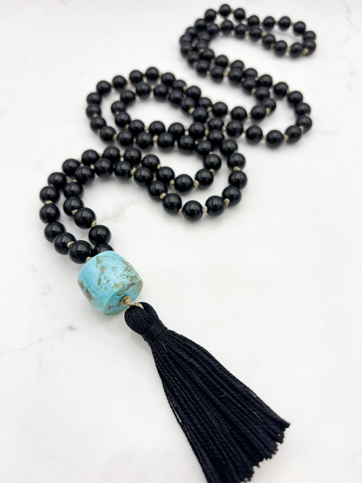onyx gemstone mala with turquoise barrel guru bead and black tassel | radiant malas | handmade in boulder, colorado