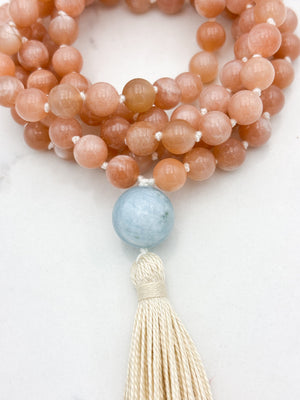 peach moonstone gemstone mala with aquamarine guru bead and cream tassel | radiant malas | handmade in boulder, colorado