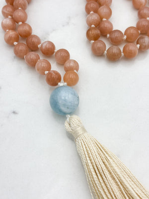peach moonstone gemstone mala with aquamarine guru bead and cream tassel | radiant malas | handmade in boulder, colorado