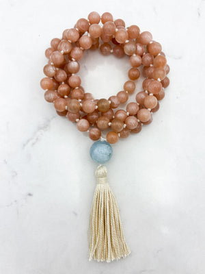 peach moonstone gemstone mala with aquamarine guru bead and cream tassel | radiant malas | handmade in boulder, colorado