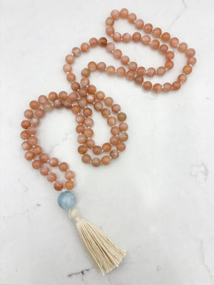 peach moonstone gemstone mala with aquamarine guru bead and cream tassel | radiant malas | handmade in boulder, colorado