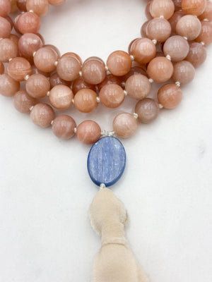 peach moonstone gemstone mala with kyanite guru bead and cream silk  tassel | radiant malas | handmade in boulder, colorado