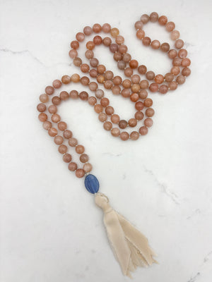 peach moonstone gemstone mala with kyanite guru bead and cream silk  tassel | radiant malas | handmade in boulder, colorado