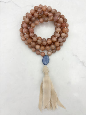 peach moonstone gemstone mala with kyanite guru bead and cream silk  tassel | radiant malas | handmade in boulder, colorado