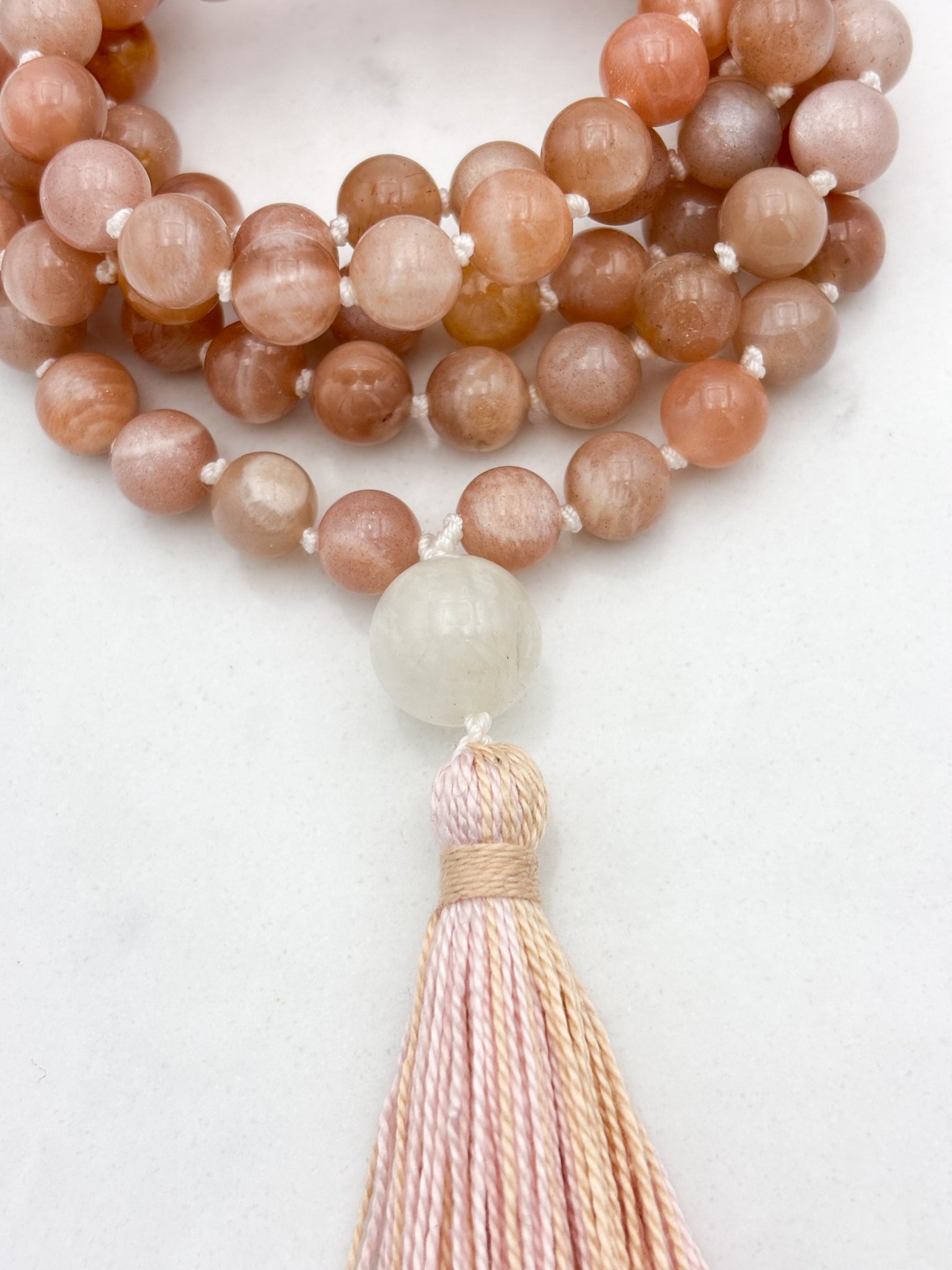 peach moonstone gemstone mala with moonstone guru bead and peach tassel | radiant malas | handmade in boulder, colorado