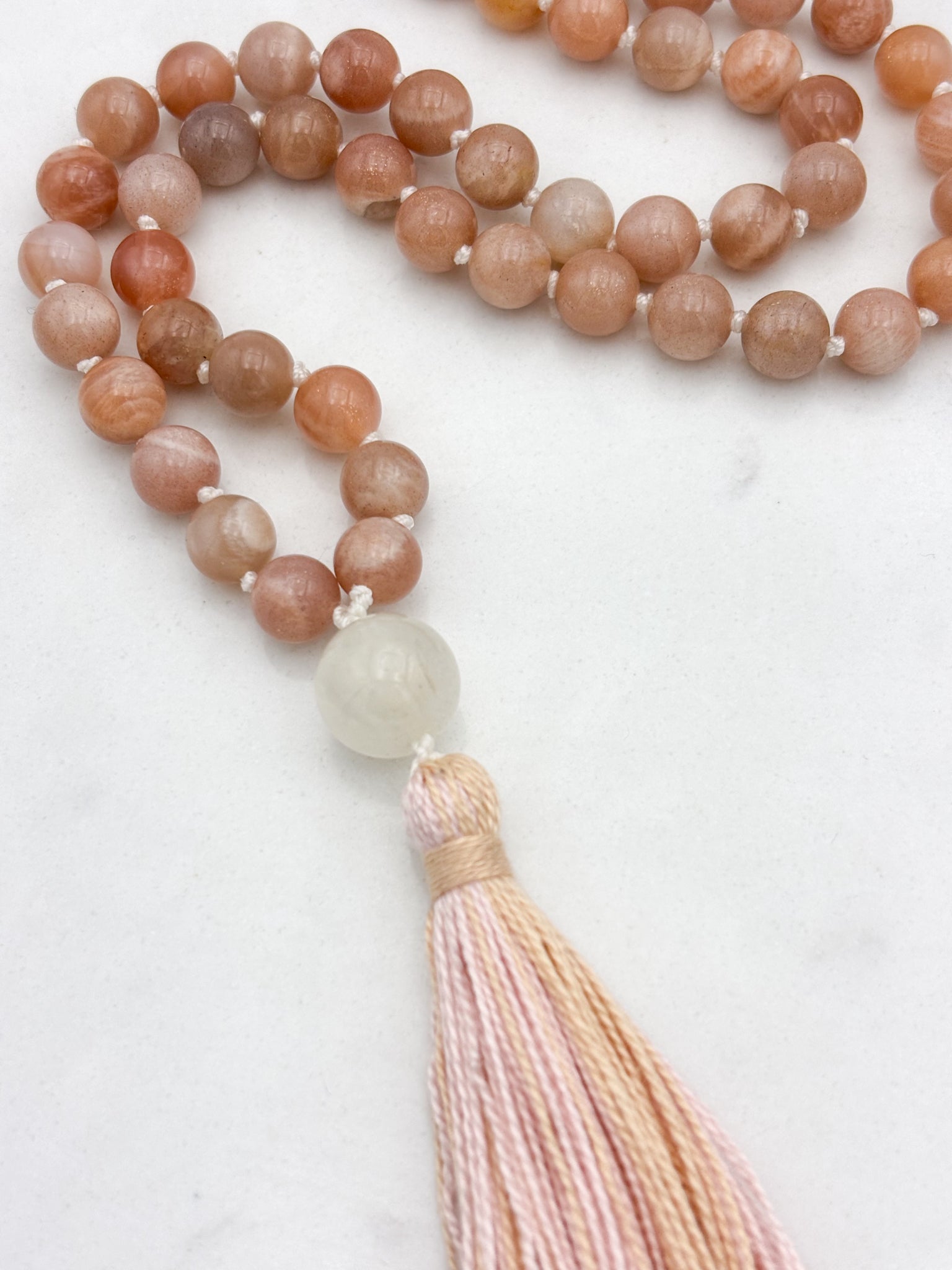 peach moonstone gemstone mala with moonstone guru bead and peach tassel | radiant malas | handmade in boulder, colorado