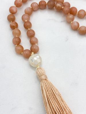 peach moonstone gemstone mala with mother of pearl guru bead and peach tassel | radiant malas | handmade in boulder, colorado