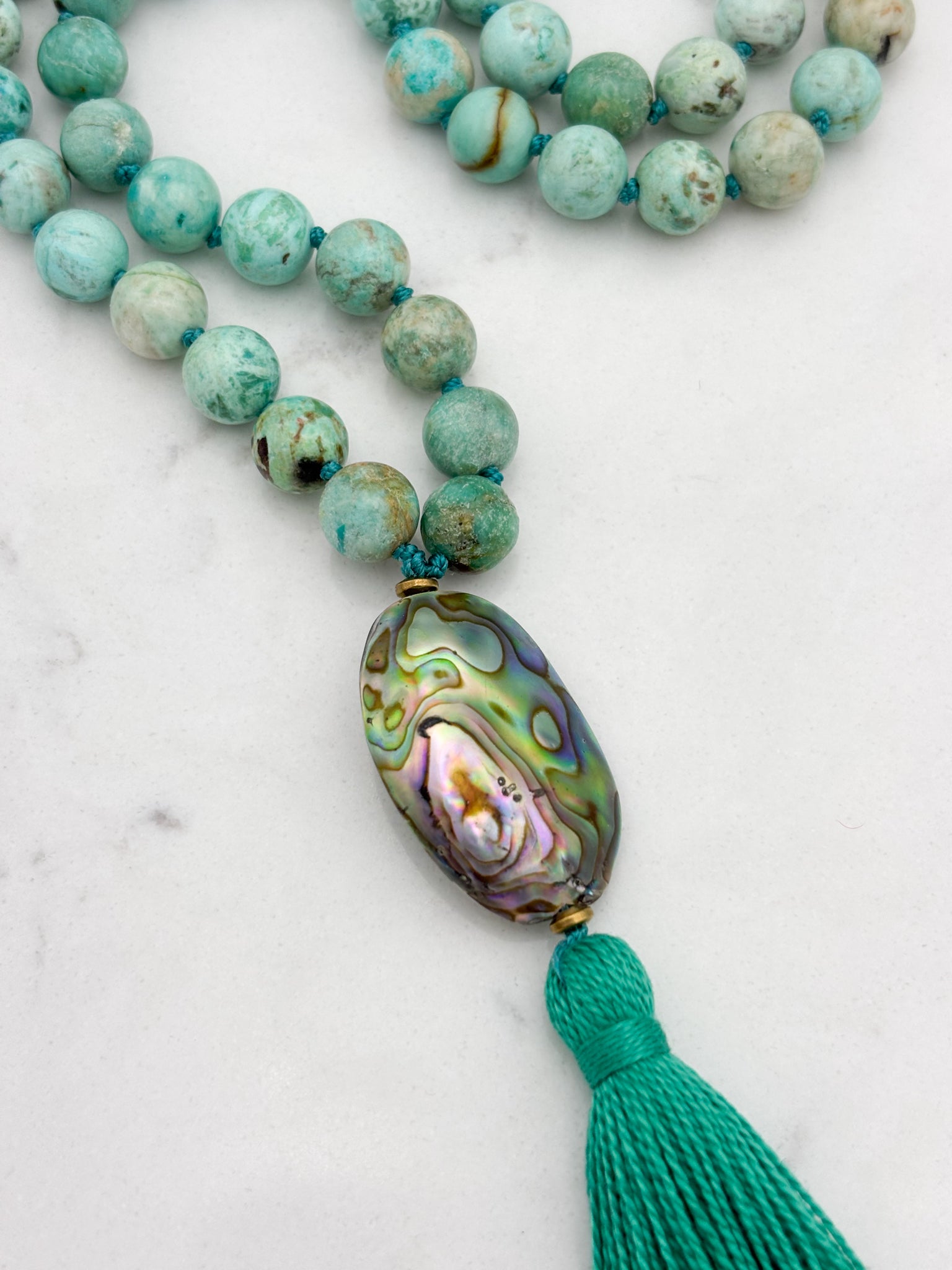 peruvian turquoise gemstone mala with abalone shell guru bead and green tassel | handmade in boulder, colorado | radiant malas