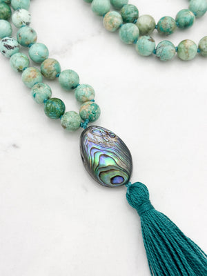 peruvian turquoise gemstone mala with abalone shell guru bead and dark green tassel | handmade in boulder, colorado | radiant malas