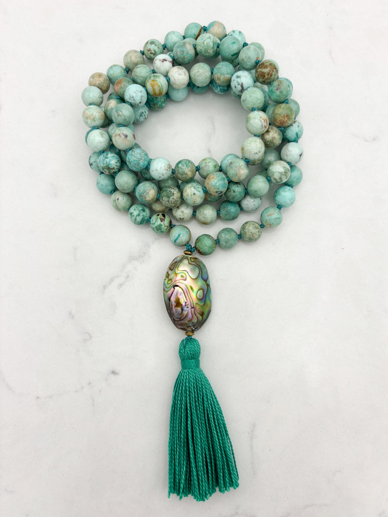 peruvian turquoise gemstone mala with abalone shell guru bead and green tassel | handmade in boulder, colorado | radiant malas