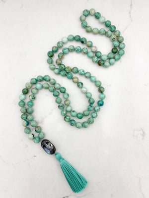 Peruvian Turquoise mala necklace with abalone shell guru bead and light green tassel | radiant malas | handmade in boulder, colorado