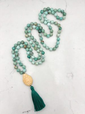 peruvian turquoise gemstone mala with carved bone buddha guru bead and green tassel | handmade in boulder, colorado | radiant malas