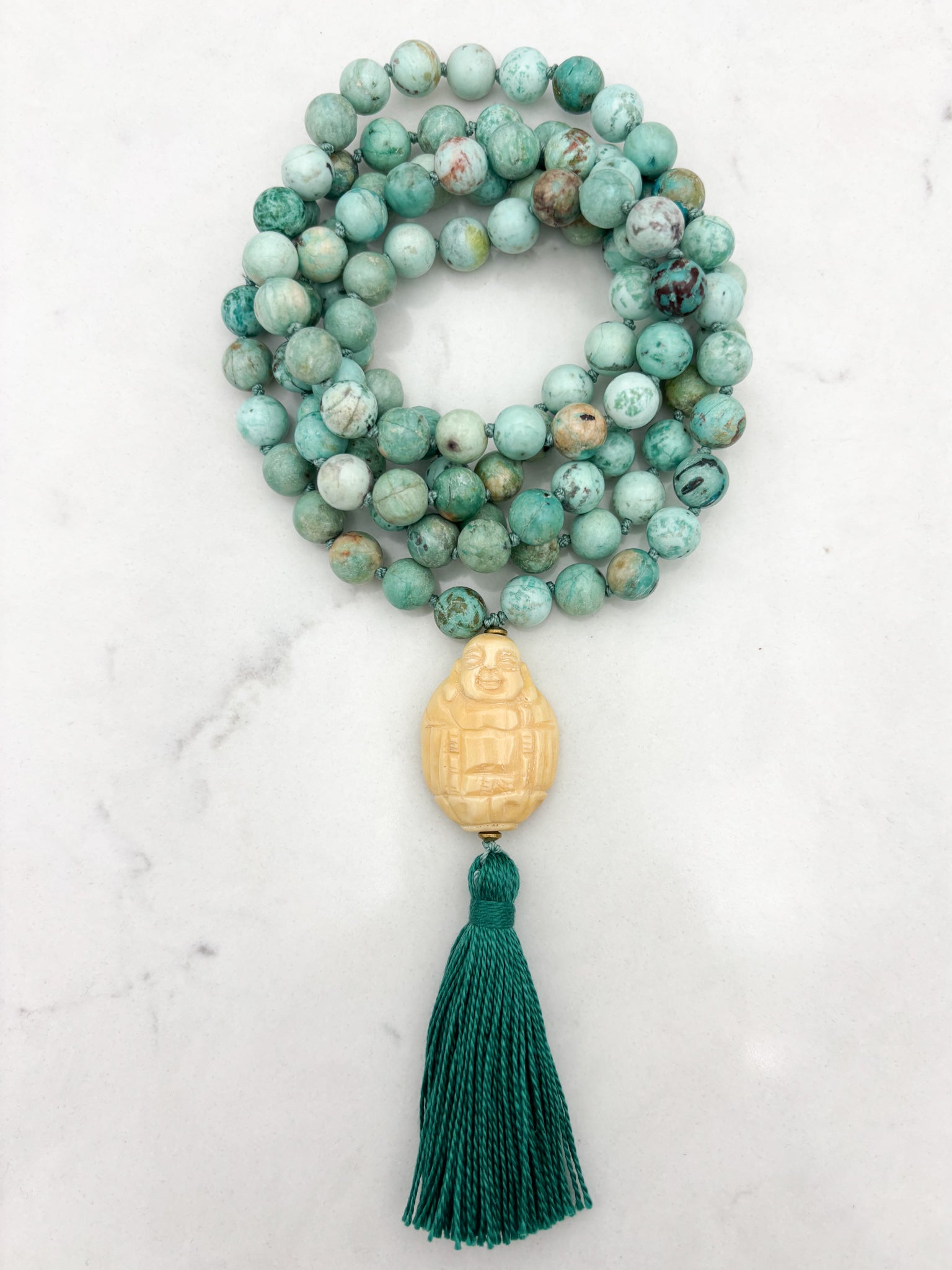 peruvian turquoise gemstone mala with carved bone buddha guru bead and green tassel | handmade in boulder, colorado | radiant malas