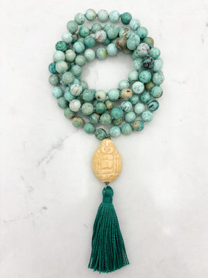 peruvian turquoise gemstone mala with carved bone buddha guru bead and green tassel | handmade in boulder, colorado | radiant malas