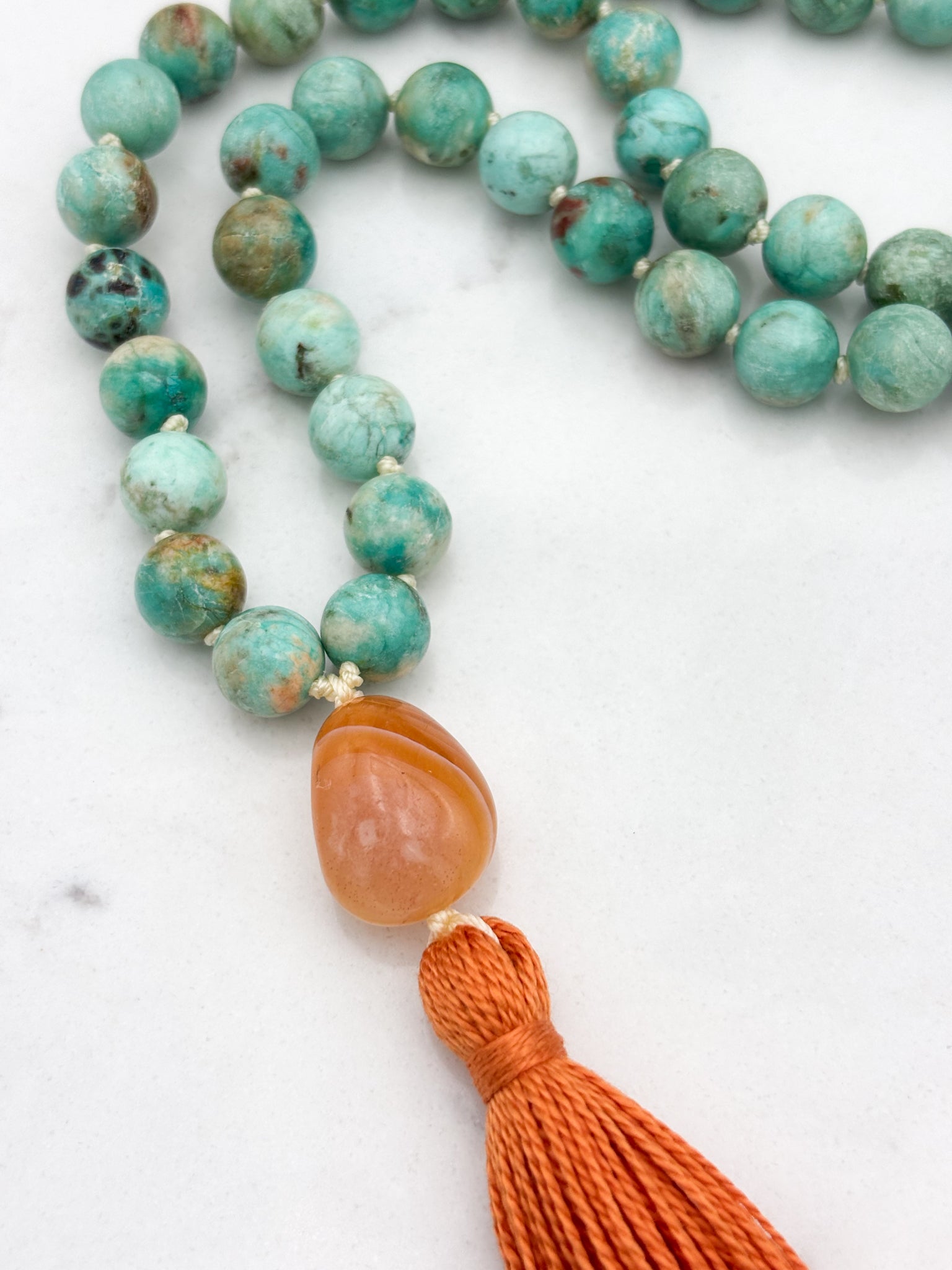 Peruvian Turquoise mala necklace with botswana agate guru bead and orange tassel | radiant malas | handmade in boulder, colorado