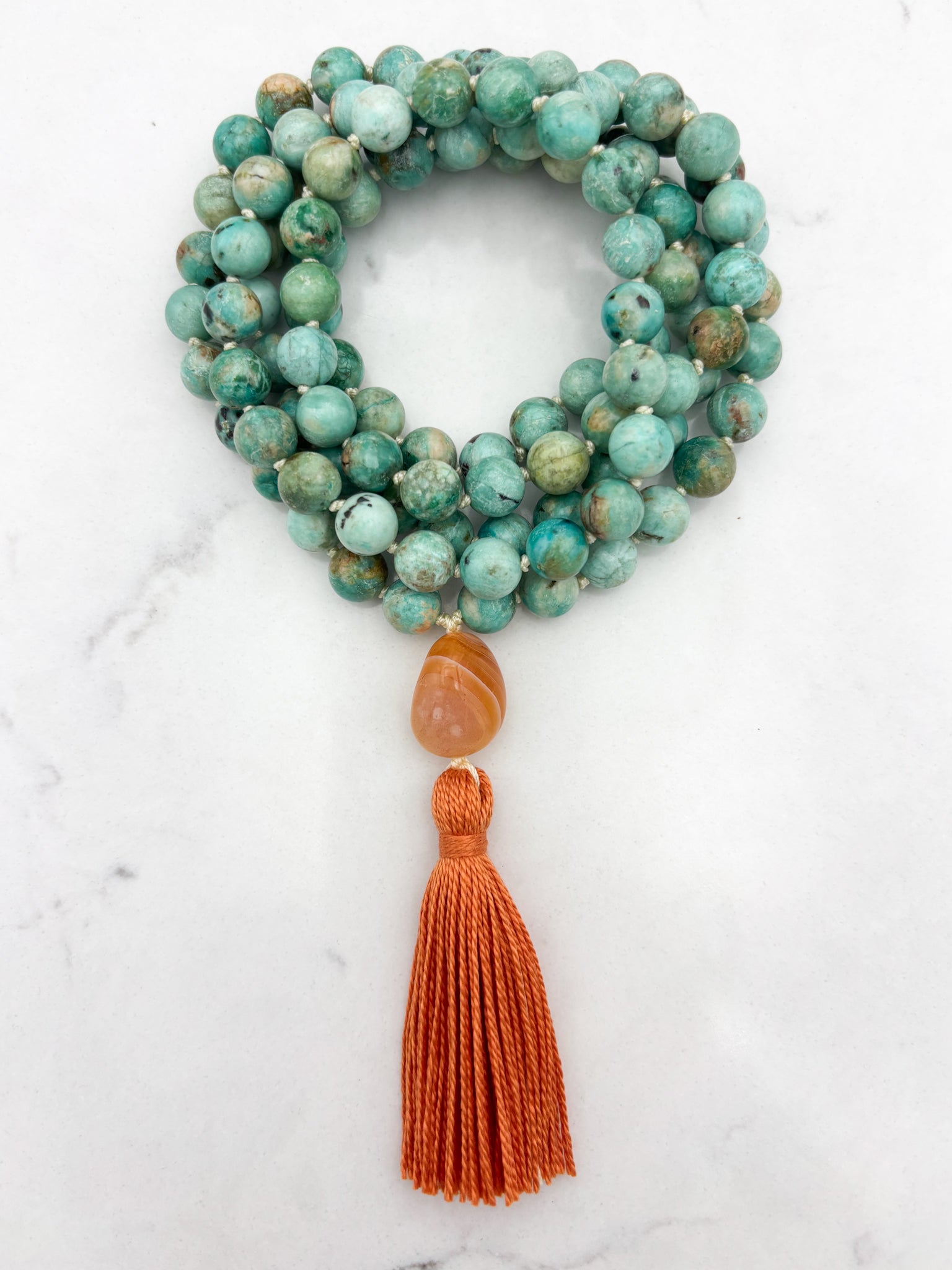 Peruvian Turquoise mala necklace with botswana agate guru bead and orange tassel | radiant malas | handmade in boulder, colorado