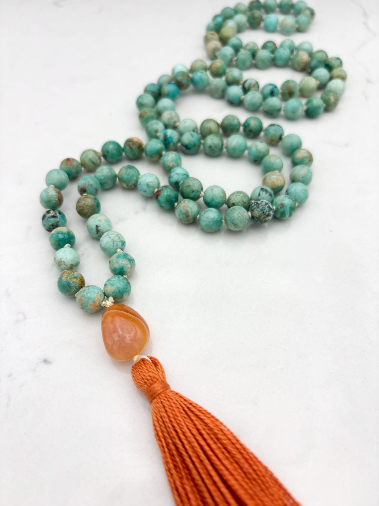Peruvian Turquoise mala necklace with botswana agate guru bead and orange tassel | radiant malas | handmade in boulder, colorado