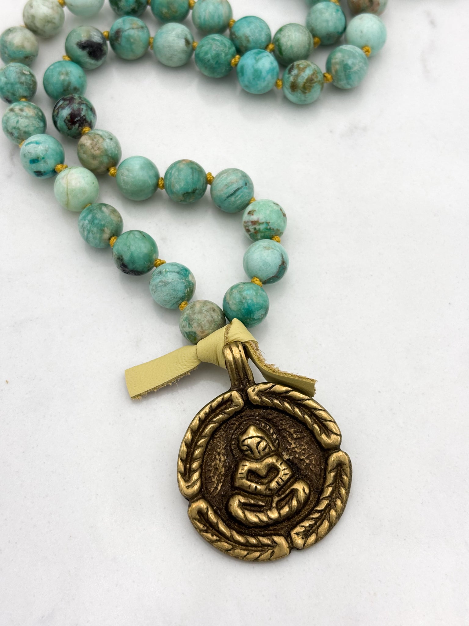Peruvian Turquoise mala necklace with brass Buddha pendant | radiant malas | handmade in boulder, colorado
