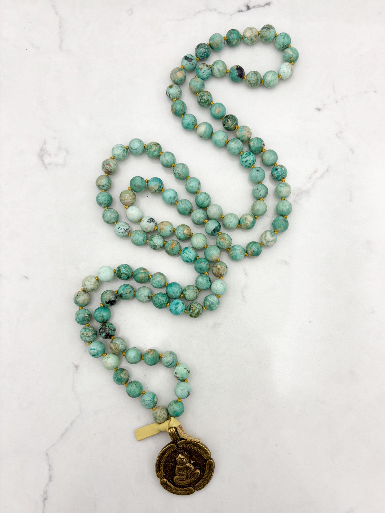 Peruvian Turquoise mala necklace with brass Buddha pendant | radiant malas | handmade in boulder, colorado
