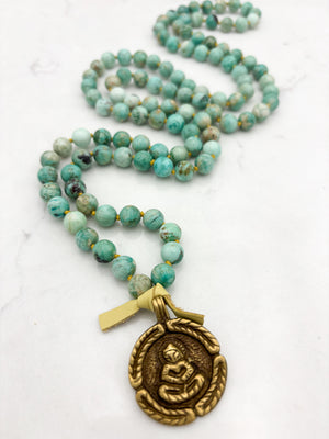 Peruvian Turquoise mala necklace with brass Buddha pendant | radiant malas | handmade in boulder, colorado