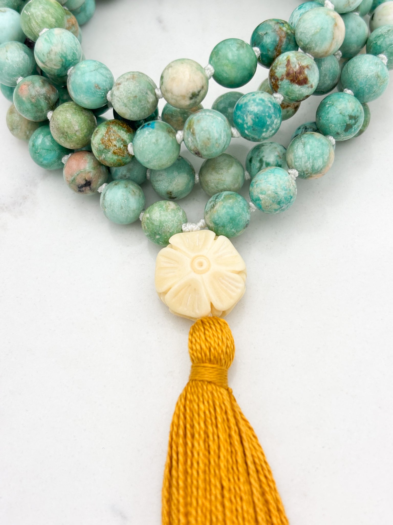 Peruvian Turquoise mala necklace with bone flower-carved guru bead and gold tassel | radiant malas | handmade in boulder, colorado