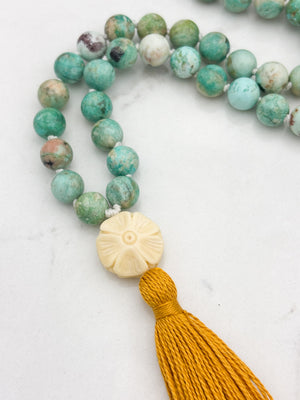 Peruvian Turquoise mala necklace with bone flower-carved guru bead and gold tassel | radiant malas | handmade in boulder, colorado