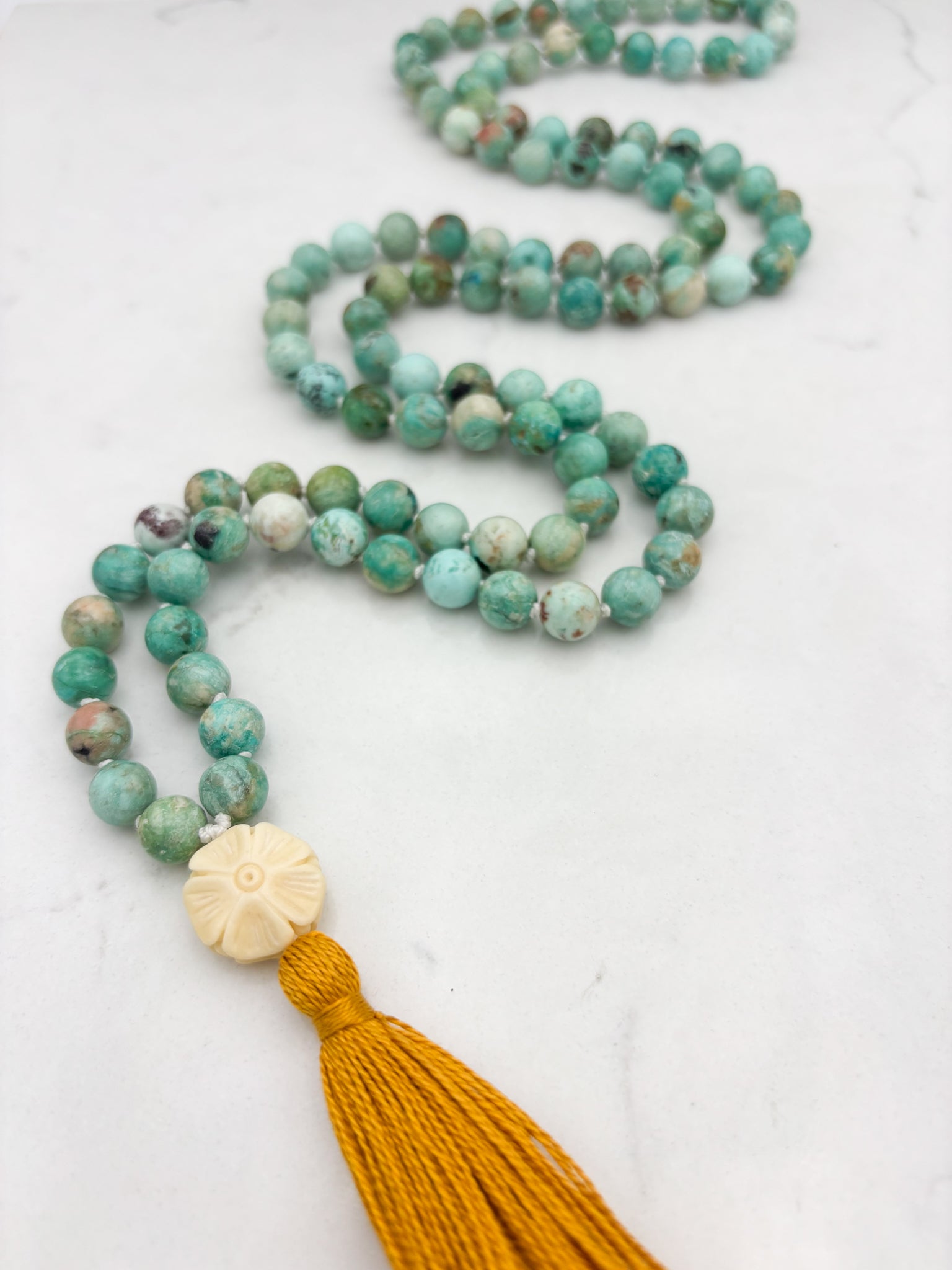 Peruvian Turquoise mala necklace with bone flower-carved guru bead and gold tassel | radiant malas | handmade in boulder, colorado
