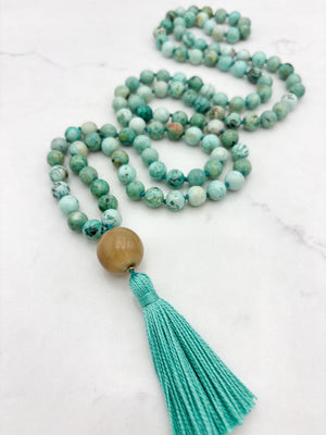 peruvian turquoise gemstone mala with polished horn guru bead and green tassel | handmade in boulder, colorado | radiant malas