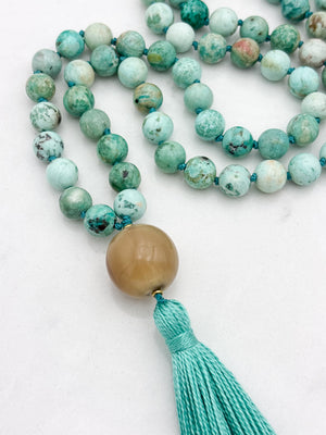 peruvian turquoise gemstone mala with polished horn guru bead and green tassel | handmade in boulder, colorado | radiant malas