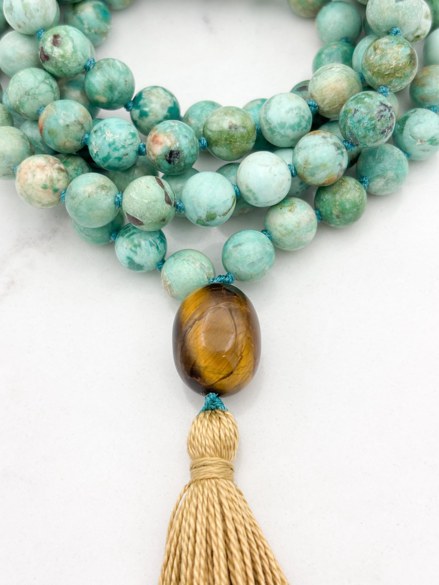 Peruvian Turquoise mala necklace with tiger's eye guru bead and light gold tassel | radiant malas | handmade in boulder, colorado