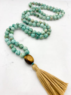 Peruvian Turquoise mala necklace with tiger's eye guru bead and light gold tassel | radiant malas | handmade in boulder, colorado