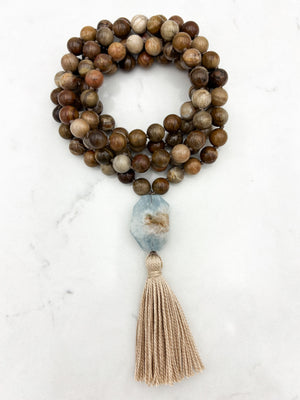 petrified wood gemstone mala with aquamarine guru bead and tan tassel | radiant malas | handmade in boulder colorado