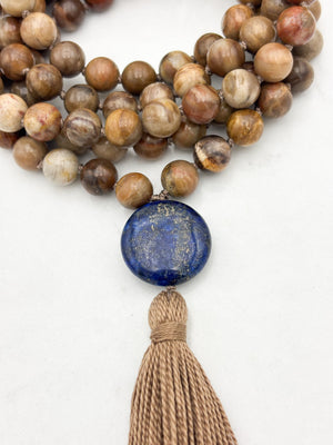 petrified wood gemstone mala with lapis guru bead and tan tassel | radiant malas | handmade in boulder, colorado