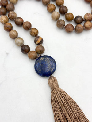 petrified wood gemstone mala with lapis guru bead and tan tassel | radiant malas | handmade in boulder, colorado