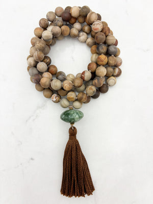 petrified wood gemstone mala with seraphinite guru bead and brown tassel | radiant malas | handmade in boulder, colorado
