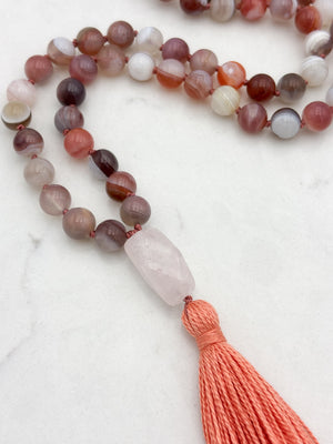 pink botswana agate gemstone mala with rose quartz guru bead and coral colored tassel | radiant malas | handmade in boulder, colorado
