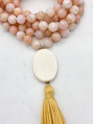 pink opal gemstone mala with oval bone guru bead and yellow colored tassel | radiant malas | handmade in boulder, colorado