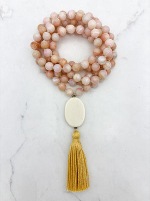 pink opal gemstone mala with oval bone guru bead and yellow colored tassel | radiant malas | handmade in boulder, colorado