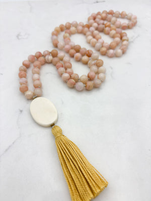 pink opal gemstone mala with oval bone guru bead and yellow colored tassel | radiant malas | handmade in boulder, colorado
