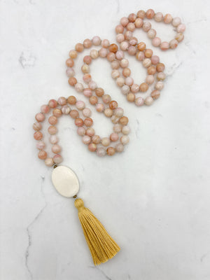 pink opal gemstone mala with oval bone guru bead and yellow colored tassel | radiant malas | handmade in boulder, colorado