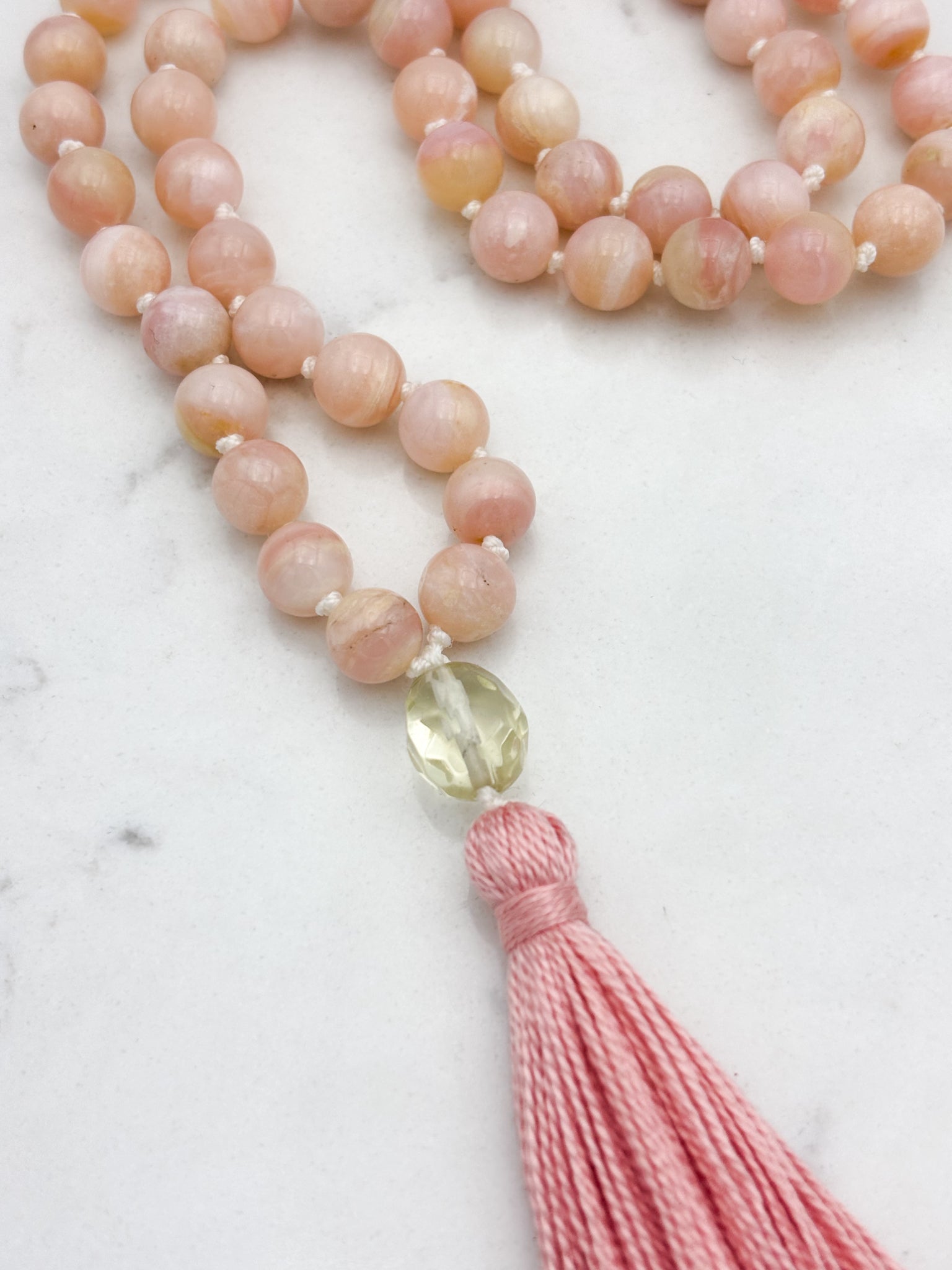 pink opal gemstone mala with faceted lemon quartz guru bead and rose colored tassel | radiant malas | handmade in boulder, colorado