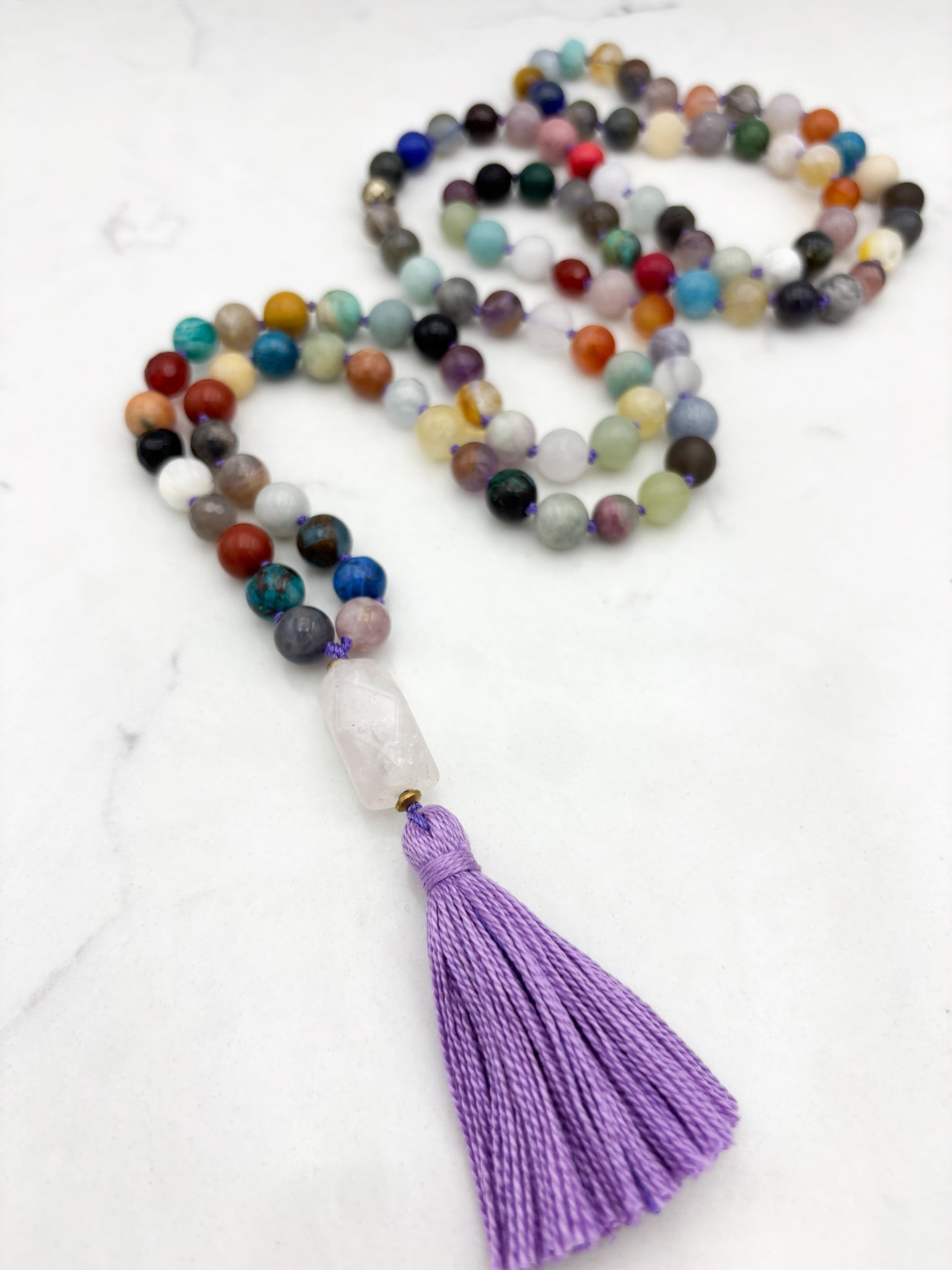 mixed gemstone mala necklace with rose quartz guru bead and purple tassel | radiant malas | handmade in boulder, colorado