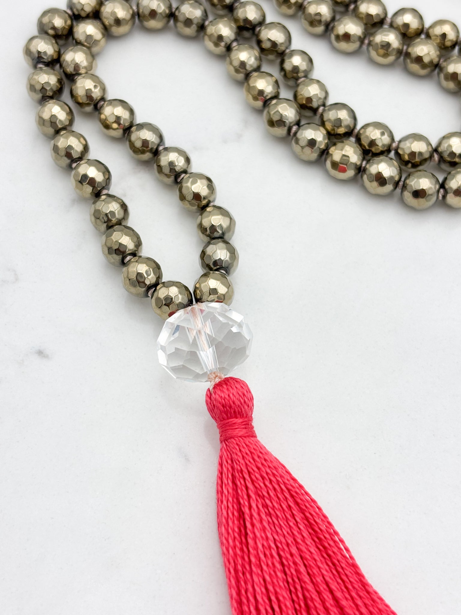 pyrite gemstone mala with faceted rock quartz guru bead and bright pink tassel | radiant malas | handmade in boulder, colorado