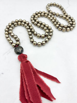 pyrite gemstone mala necklace with pyrite guru bead and burgundy silk tassel | radiant malas | handmade in boulder, colorado
