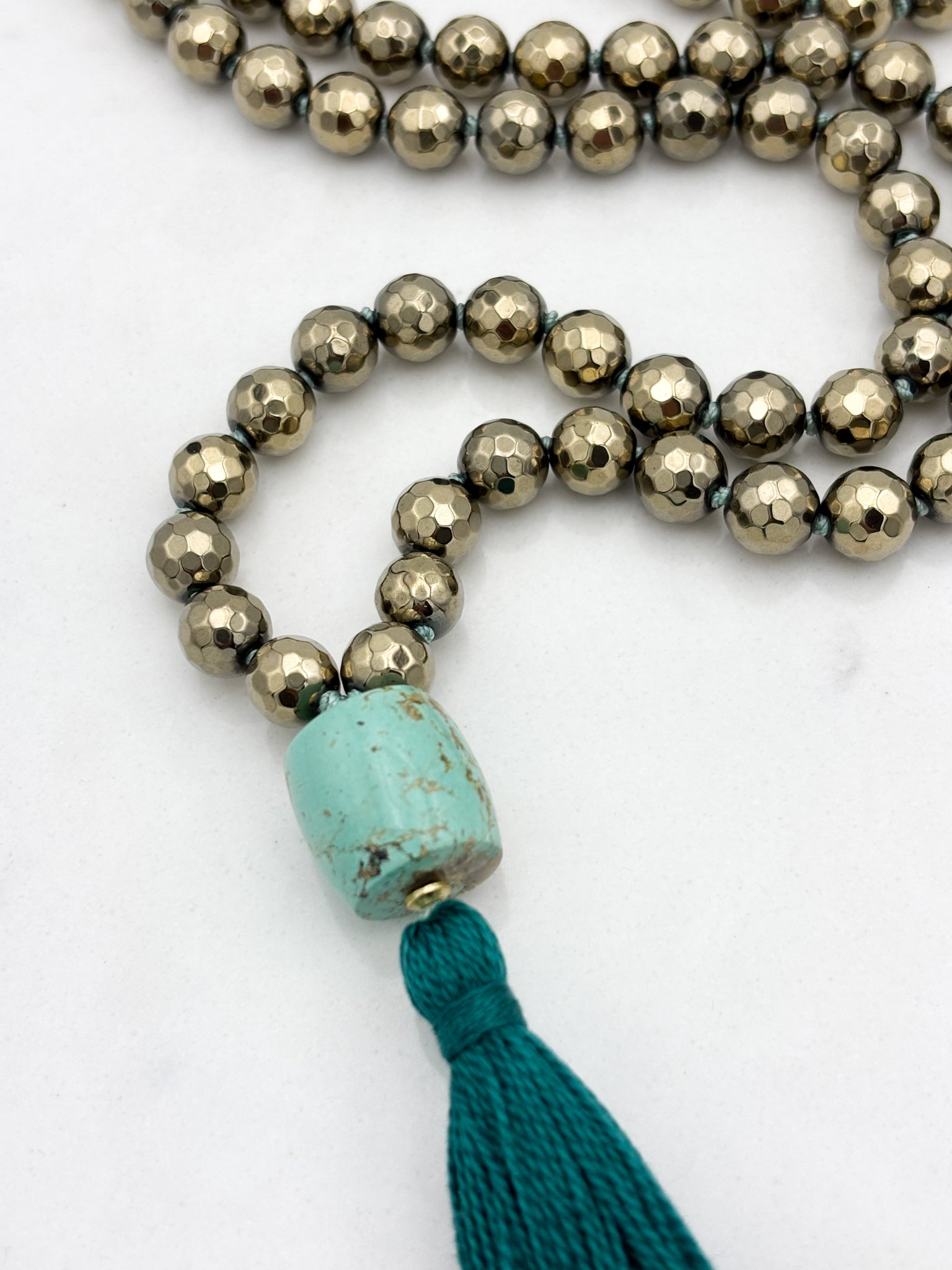 pyrite gemstone mala necklace with turquoise guru bead and green tassel | radiant malas | handmade in boulder, colorado