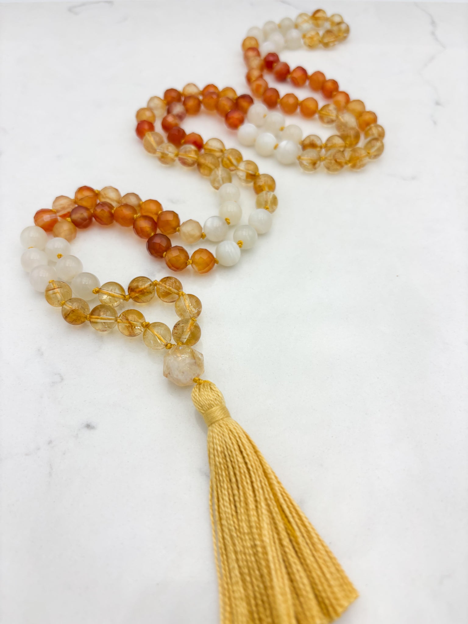 Reawakening gemstone mala with Citrine, Carnelian and Moonstone beads with Citrine guru bead and yellow tassel | handmade in boulder, colorado | radiant malas