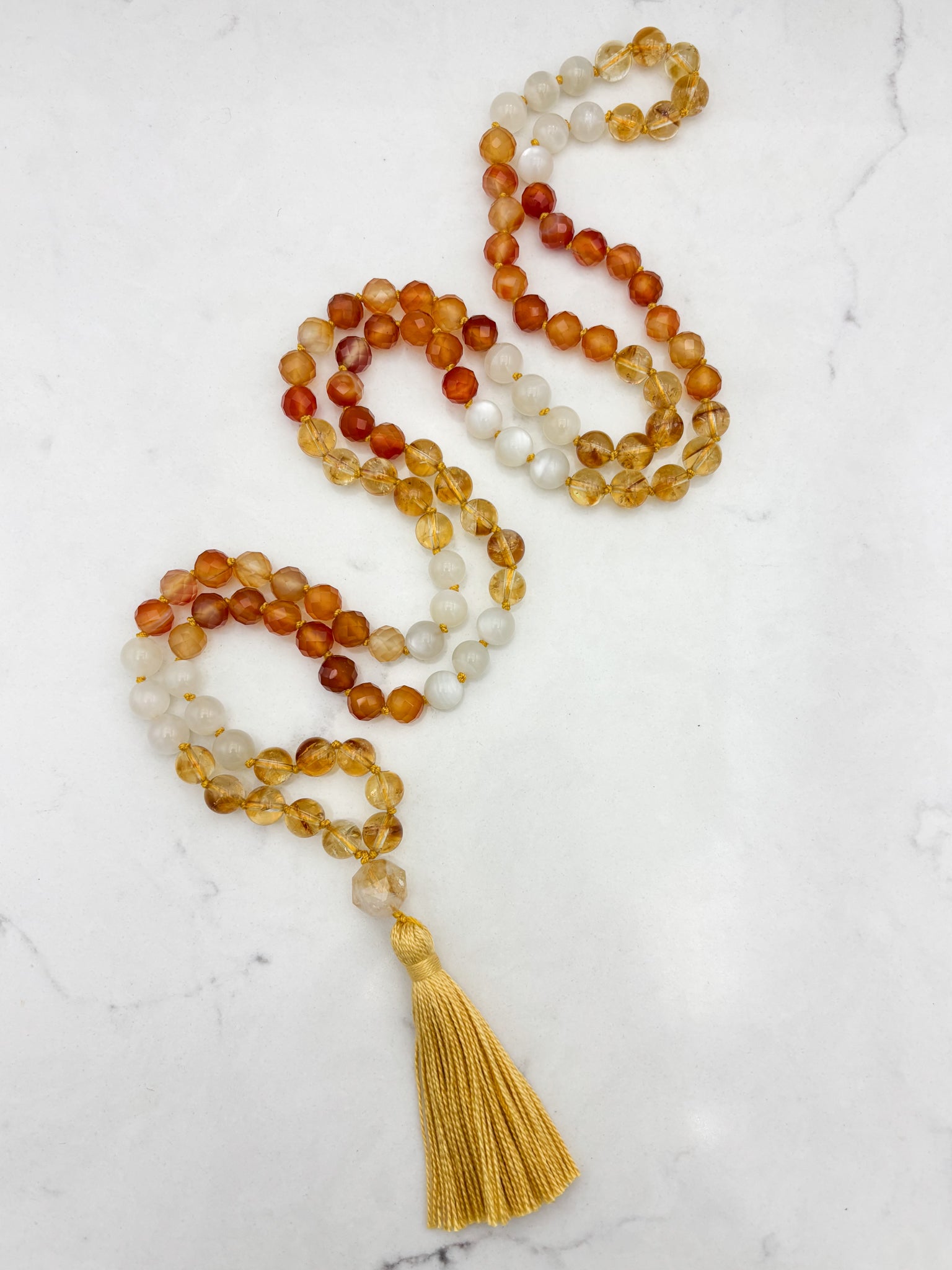 Reawakening gemstone mala with Citrine, Carnelian and Moonstone beads with Citrine guru bead and yellow tassel | handmade in boulder, colorado | radiant malas